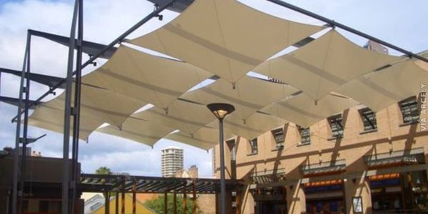 Functional and stylish tensile sun shade for commercial space in Dubai.